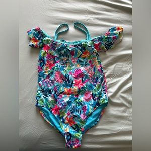 This is a blue tropical bathing suit for children.